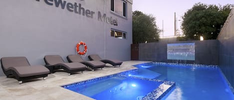 Outdoor pool, open 7:00 AM to 8:00 PM, pool loungers