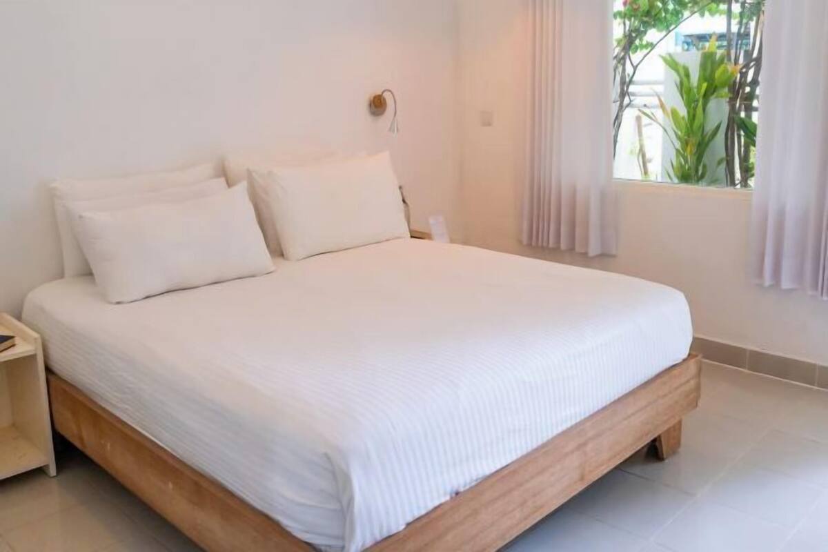Down comforters, pillowtop beds, in-room safe, desk