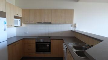 2 Bedroom Apartment, Second Floor 3 | Private kitchen | Full-sized fridge, microwave