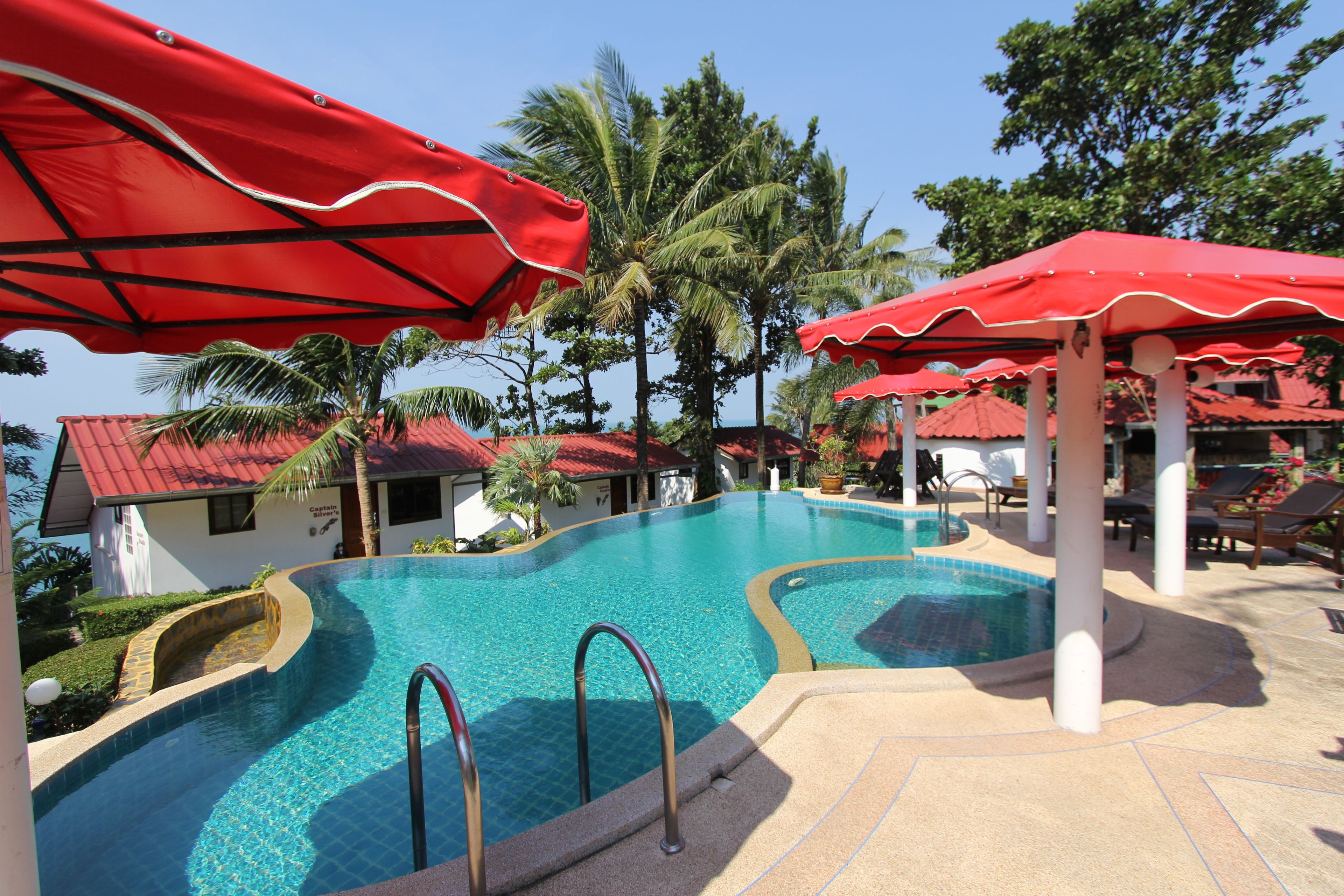 Outdoor pool, open 7 AM to 9 PM, pool umbrellas, pool loungers