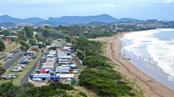 A coastal area with a caravan park and beach.
