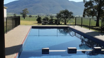 Outdoor pool, open 8:00 AM to 6:30 PM, pool loungers