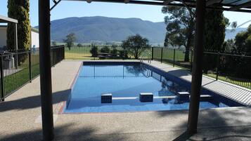 Outdoor pool, open 8:00 AM to 6:30 PM, pool loungers