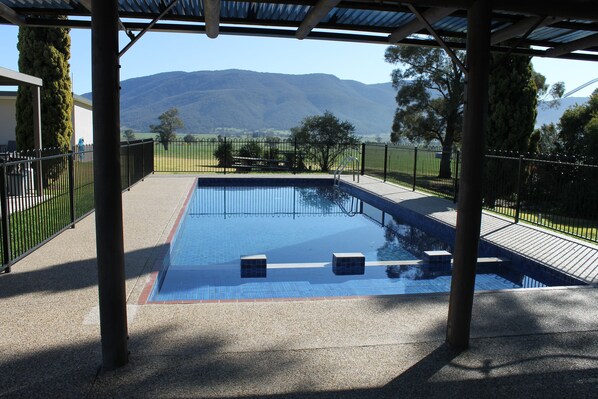 Outdoor pool, open 8:00 AM to 6:30 PM, pool loungers