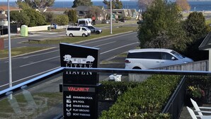 A signboard listing amenities such as a swimming pool, spa pool, games room, play ground, and boat parking. - Little Haven (Taupo)