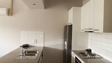 Two Bedroom Apartment | Private kitchen | Fridge, coffee/tea maker, electric kettle