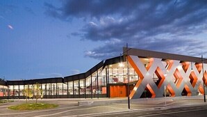 A modern building with a distinctive geometric facade and large windows. - Fountain Court Motor Inn Albury (Albury)