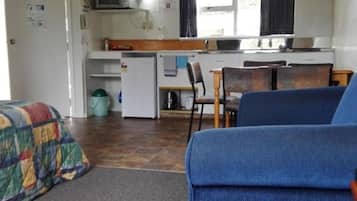 Apartamento superior, 1 habitación | Zona de estar