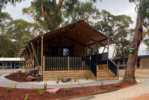 Situated in a landscaped area, this cabin-style retreat offers a peaceful escape with a balcony.