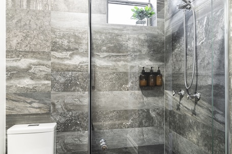 Shower, rainfall showerhead, free toiletries, towels. The Alison Randwick