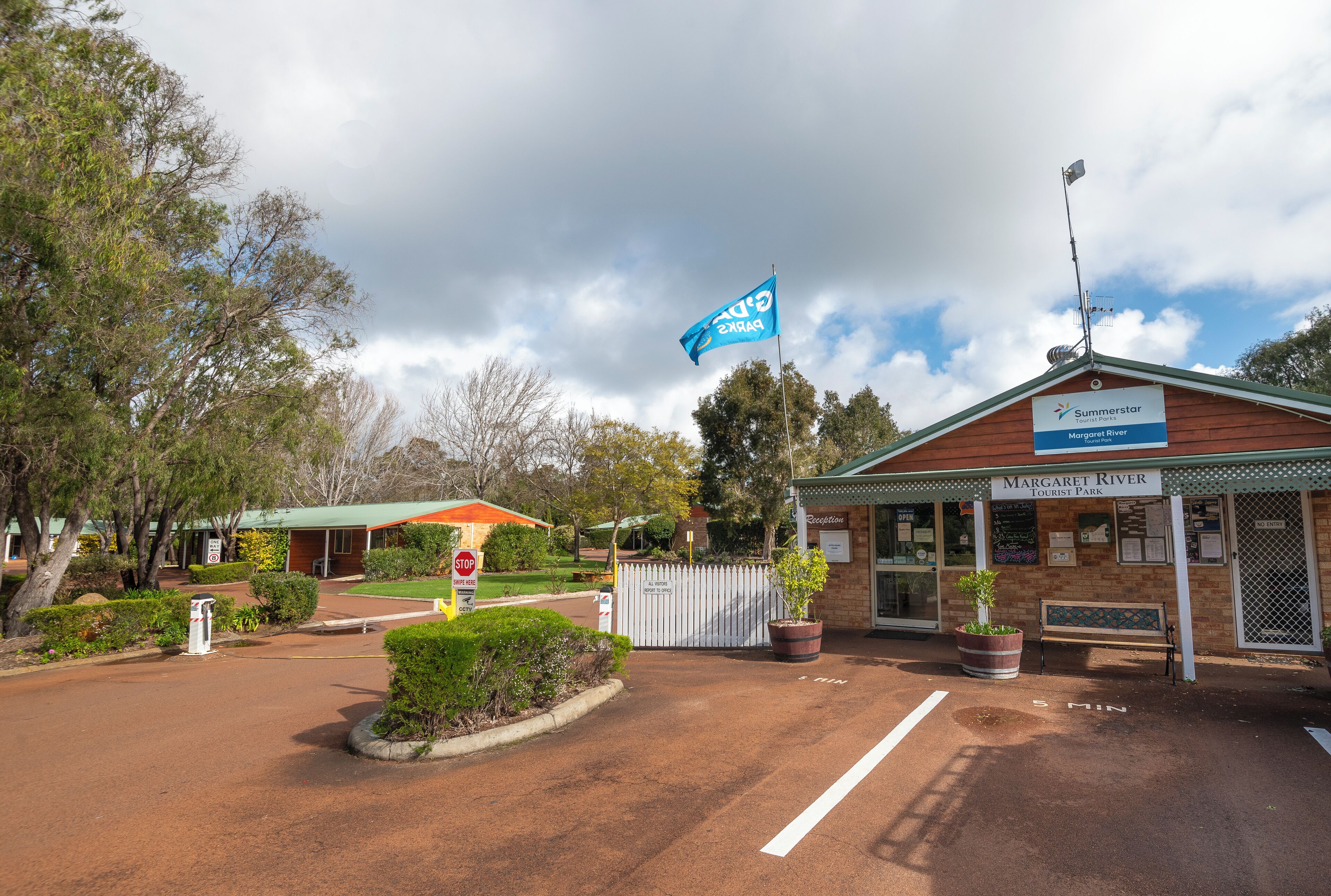A tourist park entrance with a sign for Margaret River.