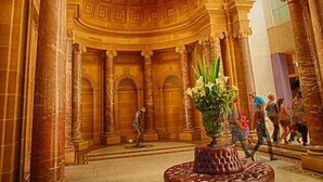 A grand hall with high ceilings, large columns, and a central circular skylight. - Hotel Coronation (Sydney)