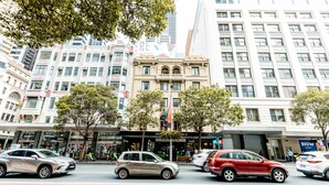 A hotel with a classic facade, multiple floors, and a prominent entrance. - Hotel Coronation (Sydney)