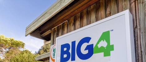 A sign for BIG4 Holiday Parks Classic Reception.