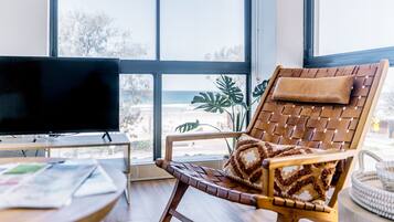 Two-Bedroom Apartment with Ocean View Deluxe | Living area | 40-inch flat-screen TV with satellite channels, TV