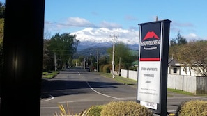 A sign for Snowhaven Accommodation advertising studio apartments, townhouses, and lodges.