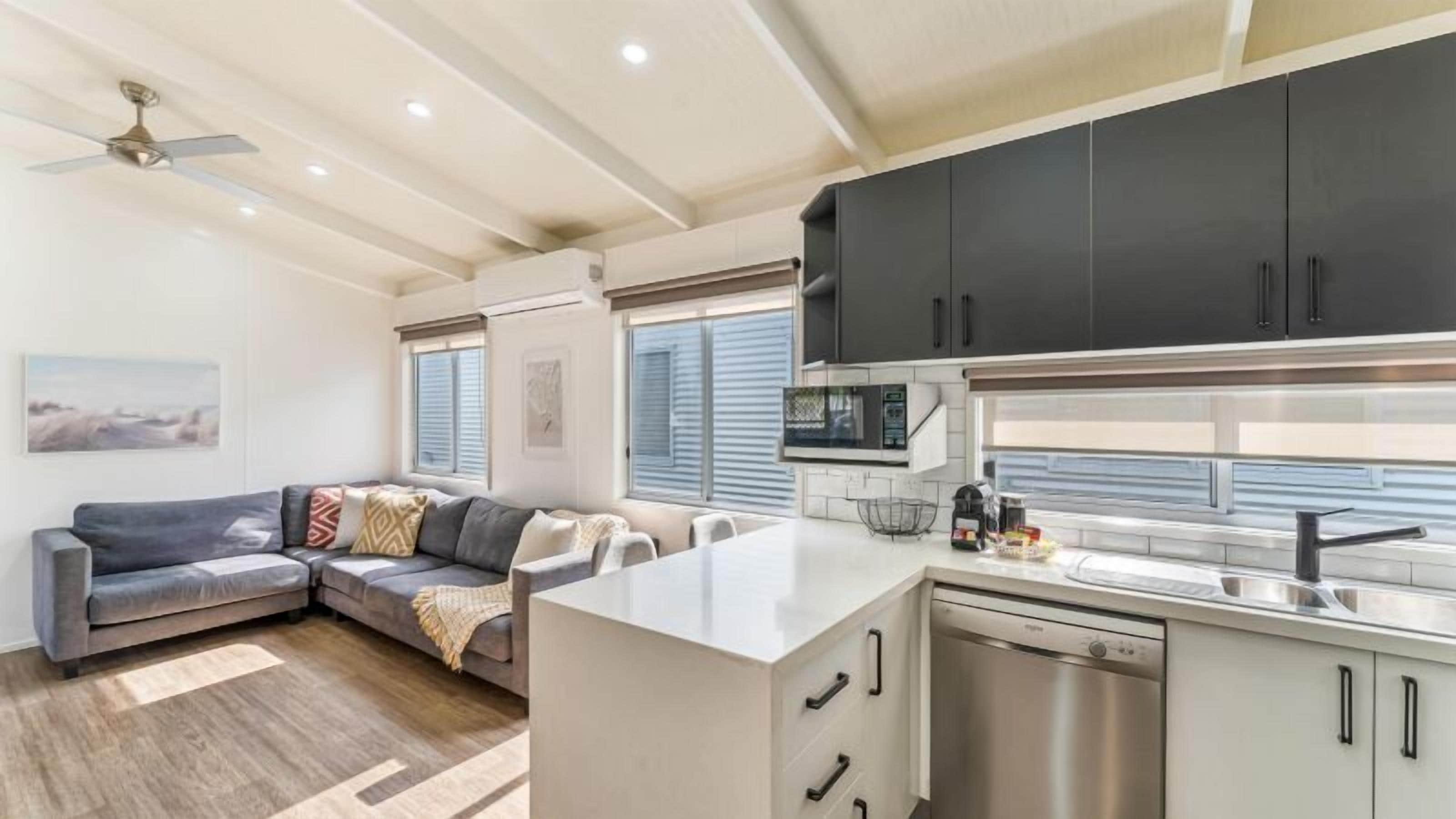 Deluxe Cabin (3BR) | Living area | Flat-screen TV, DVD player