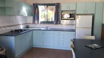 Cassowary Villa | Private kitchen | Fridge, microwave, stovetop, coffee/tea maker