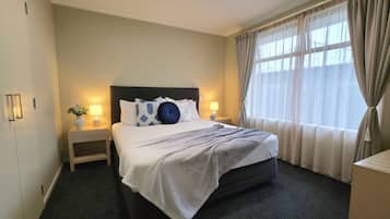 Premium bedding, desk, blackout drapes, soundproofing