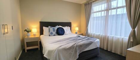 Premium bedding, desk, blackout curtains, soundproofing