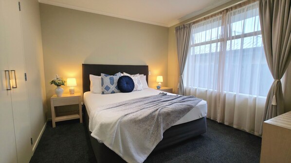 Premium bedding, desk, blackout curtains, soundproofing