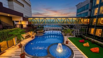 Outdoor pool, open 6:00 AM to 6:00 PM, sun loungers, lifeguards on site