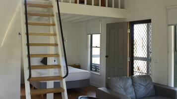 Superior Family Cottage | Living area | 60-cm TV with digital channels, streaming services