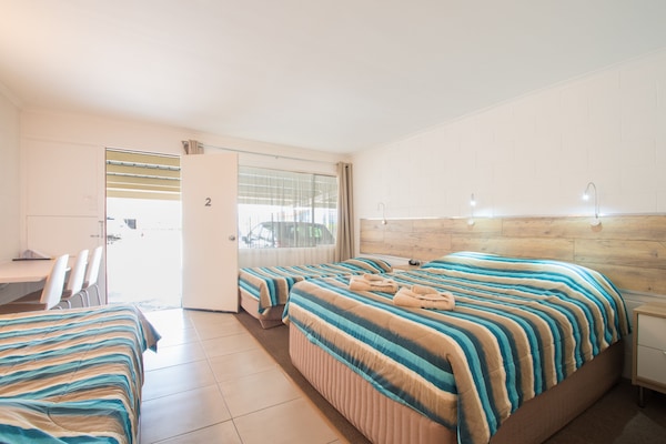 Standard Suite, 1 Bedroom, Non Smoking (Quad Room) | Desk, soundproofing, iron/ironing board, free cribs/infant beds