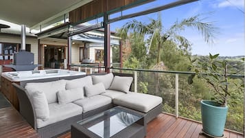 Relax in style with a comfortable sofa and expansive views of the surrounding landscape.