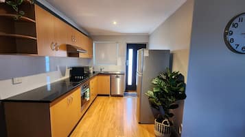 Standard Apartment, 2 Bedrooms | Private kitchen | Dining tables