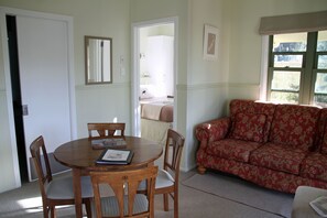 Standard Suite, 2 Bedrooms, Non Smoking, Kitchenette (Bellbird) | Living area - Clive Colonial Cottages (Clive)