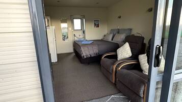 King Studio Unit | Premium bedding, pillow-top beds, laptop workspace, iron/ironing board