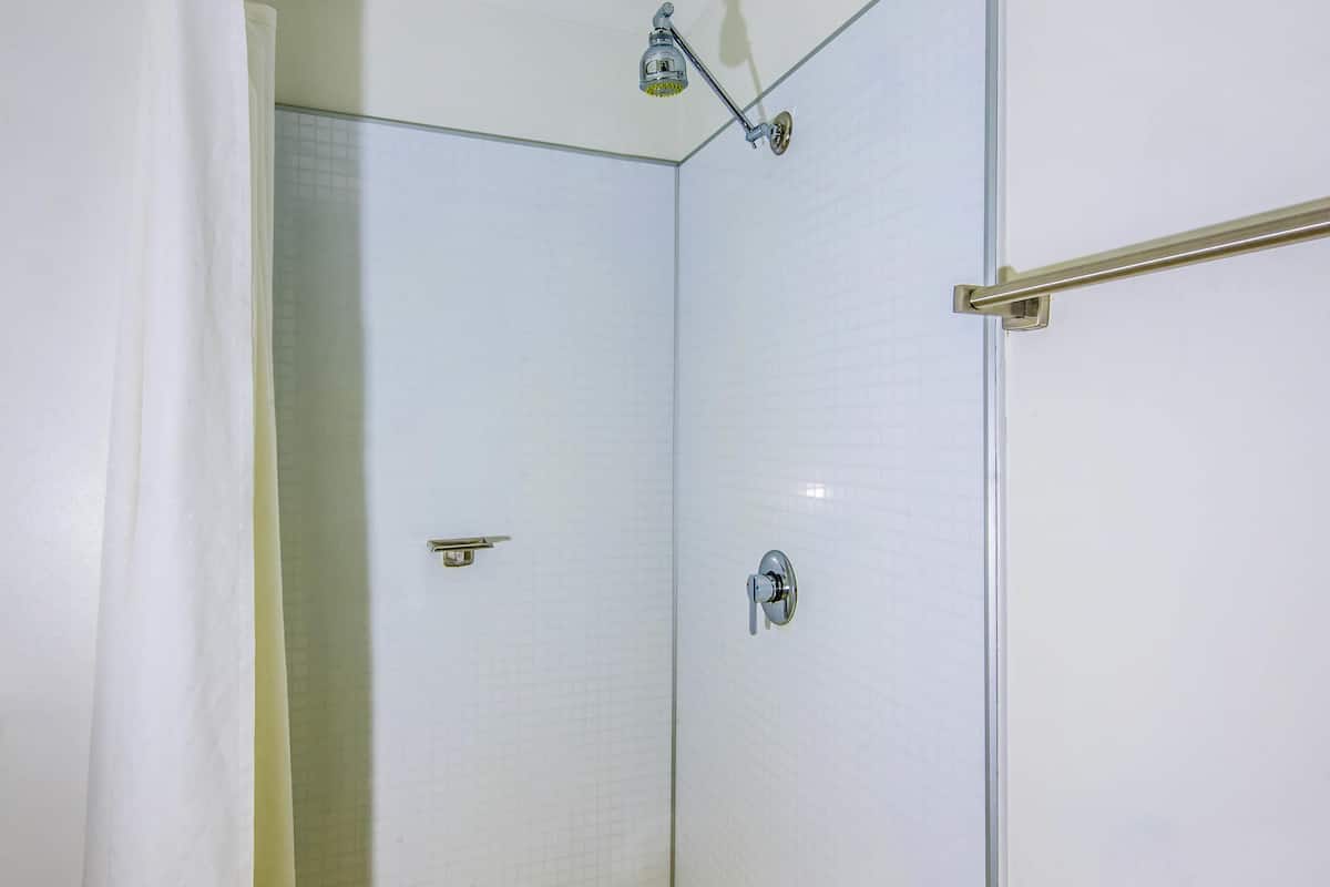 premium bedding, laptop workspace, blackout curtains, cots/infant beds