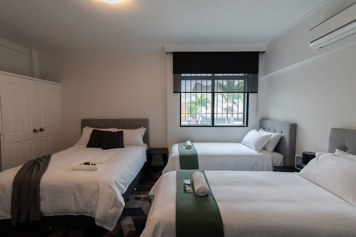 Queen + 2 Single Room | Desk, iron/ironing board, bed sheets