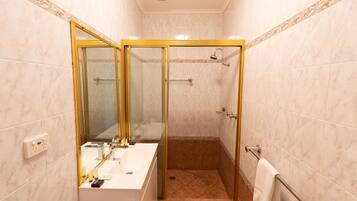 Shower, rainfall showerhead, eco-friendly toiletries, towels