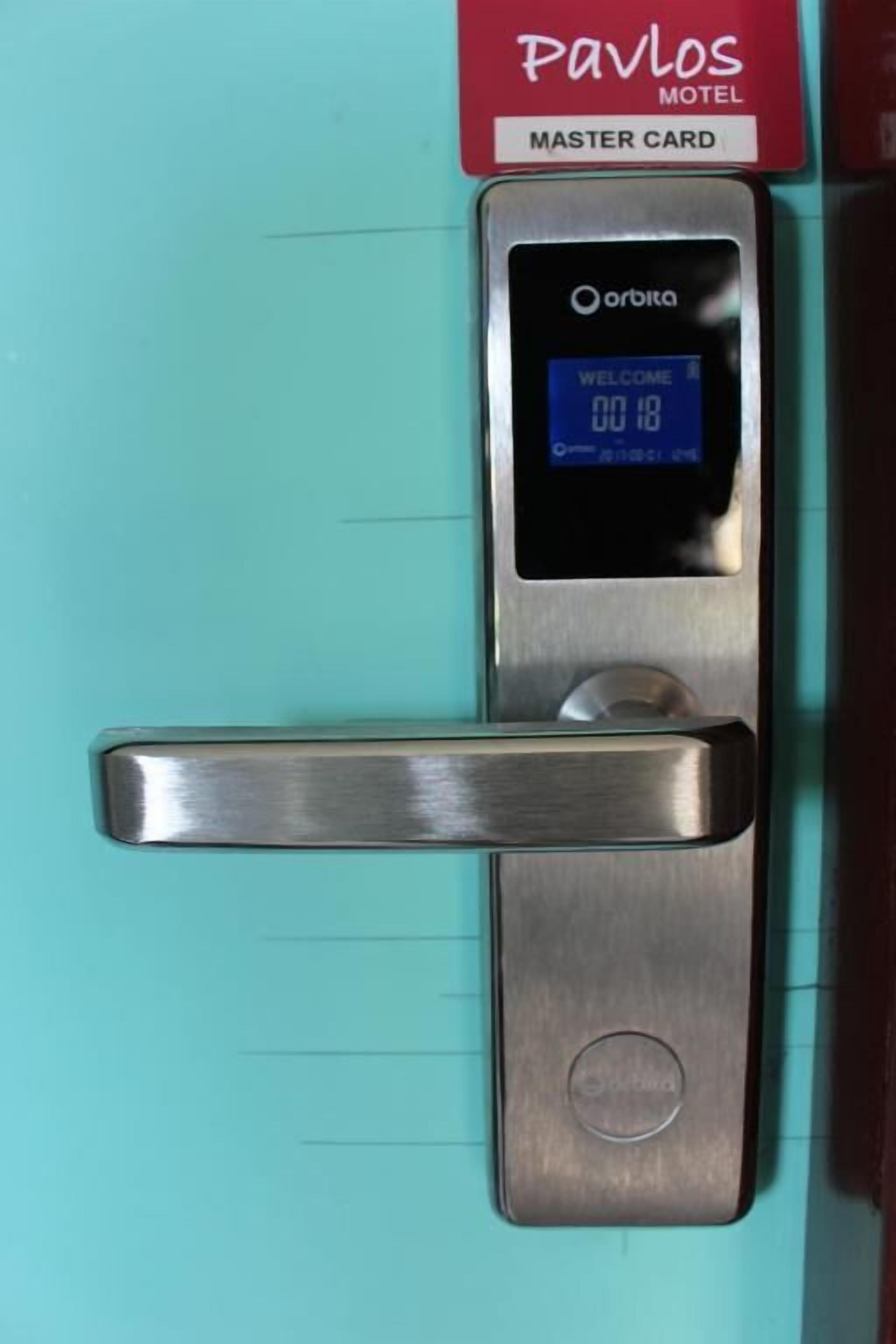A door with a digital lock displaying "WELCOME" and "00:18".