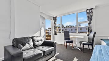 Large Studio | Living area | 32-inch flat-screen TV with digital channels, TV