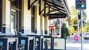 A sports bar with outdoor seating and a sign for 'The Albion Hotel' in the background. - The Albion Hotel (Wickham)