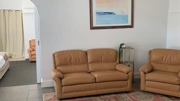 Family Apartment, 2 Bedrooms, Kitchen, Garden View | Living area | 32-inch Smart TV with digital channels, Netflix, streaming services