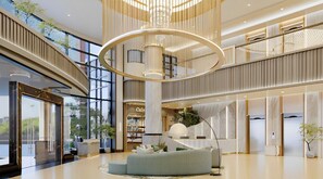 A spacious lobby with a central seating area, a large chandelier, and a view of the outdoors through large windows. - The Acacia Hotel Jakarta (Jakarta)