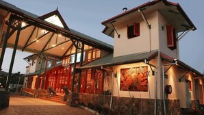A two-story building with a covered entrance and a large mural on the side. - Tinaroo Lake Resort (Tinaroo)