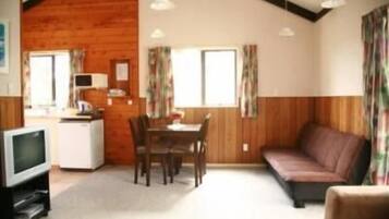Standard Suite, 2 Bedrooms, Non Smoking, Kitchen (Cottage) | Living area | Flat-screen TV
