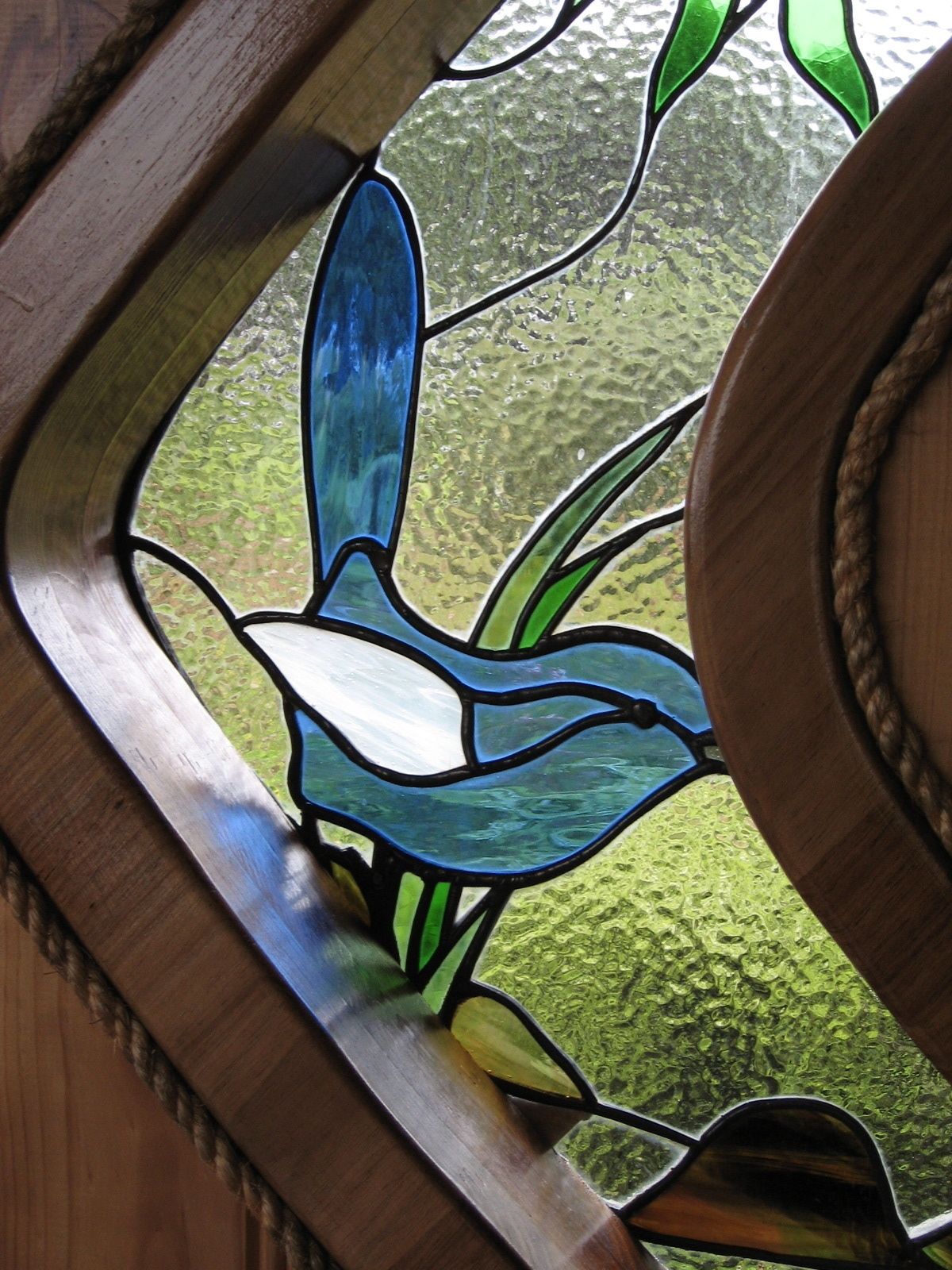 A stained glass window with a floral design.