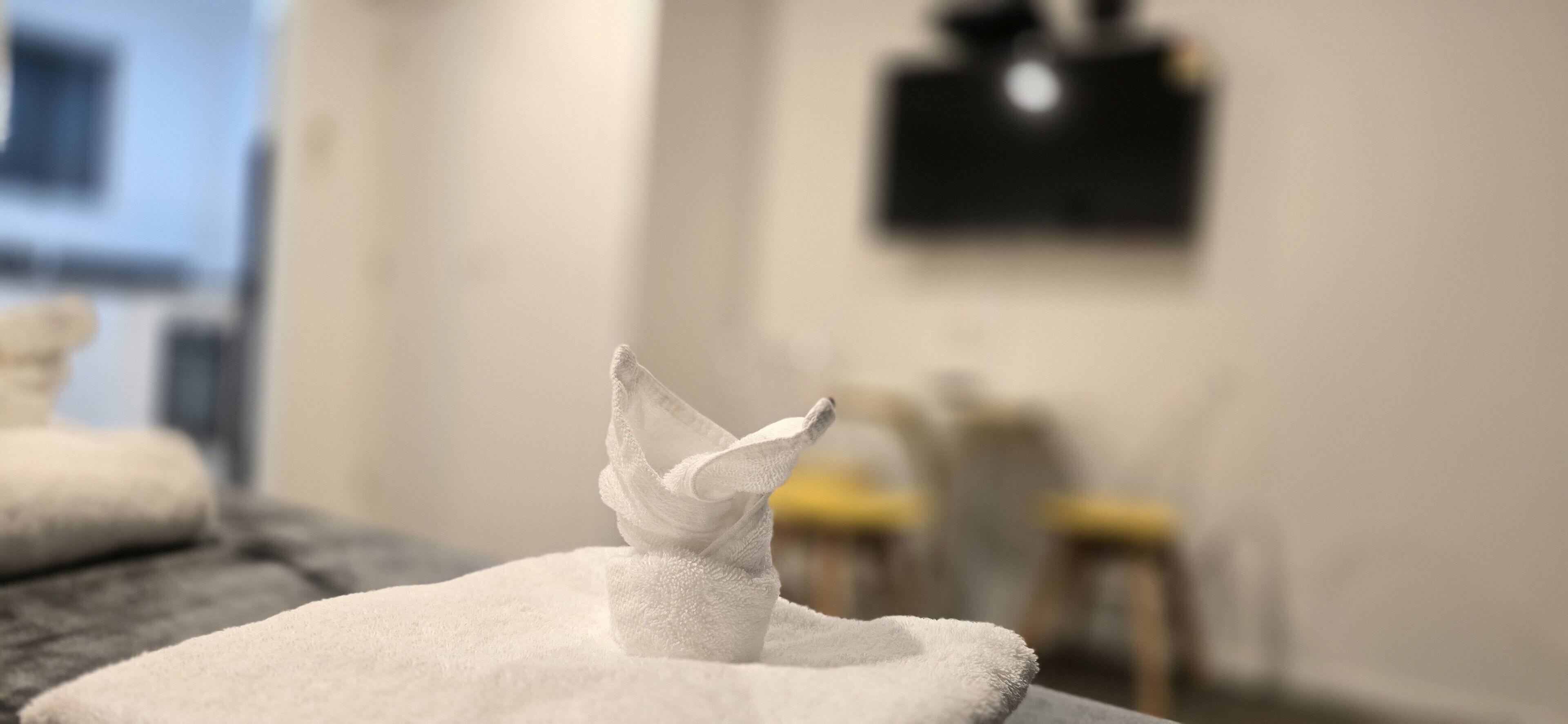 A 3D-printed sculpture on a white cushion in a room with a blurred background.