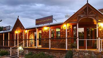 A building with a sign reading "Rubyvale Gem Gallery" and a staircase leading to the entrance.