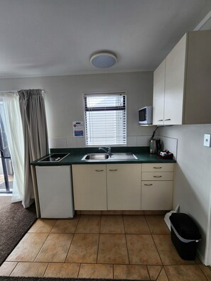 Basic Suite, 1 Queen Bed, Accessible, Non Smoking | Private kitchenette | Fridge, microwave, espresso maker, coffee/tea maker - Aquarius Motor Inn (Tauranga)