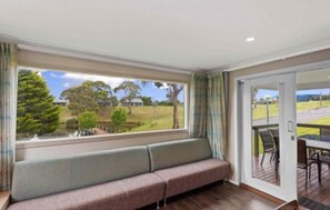 Deluxe 3 Bedroom Lakeview Cottage | Living area | 32-inch LED TV with digital channels, TV