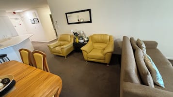 1 Bedroom Honeymoon Spa Suite | Living area | 42-inch TV with digital channels