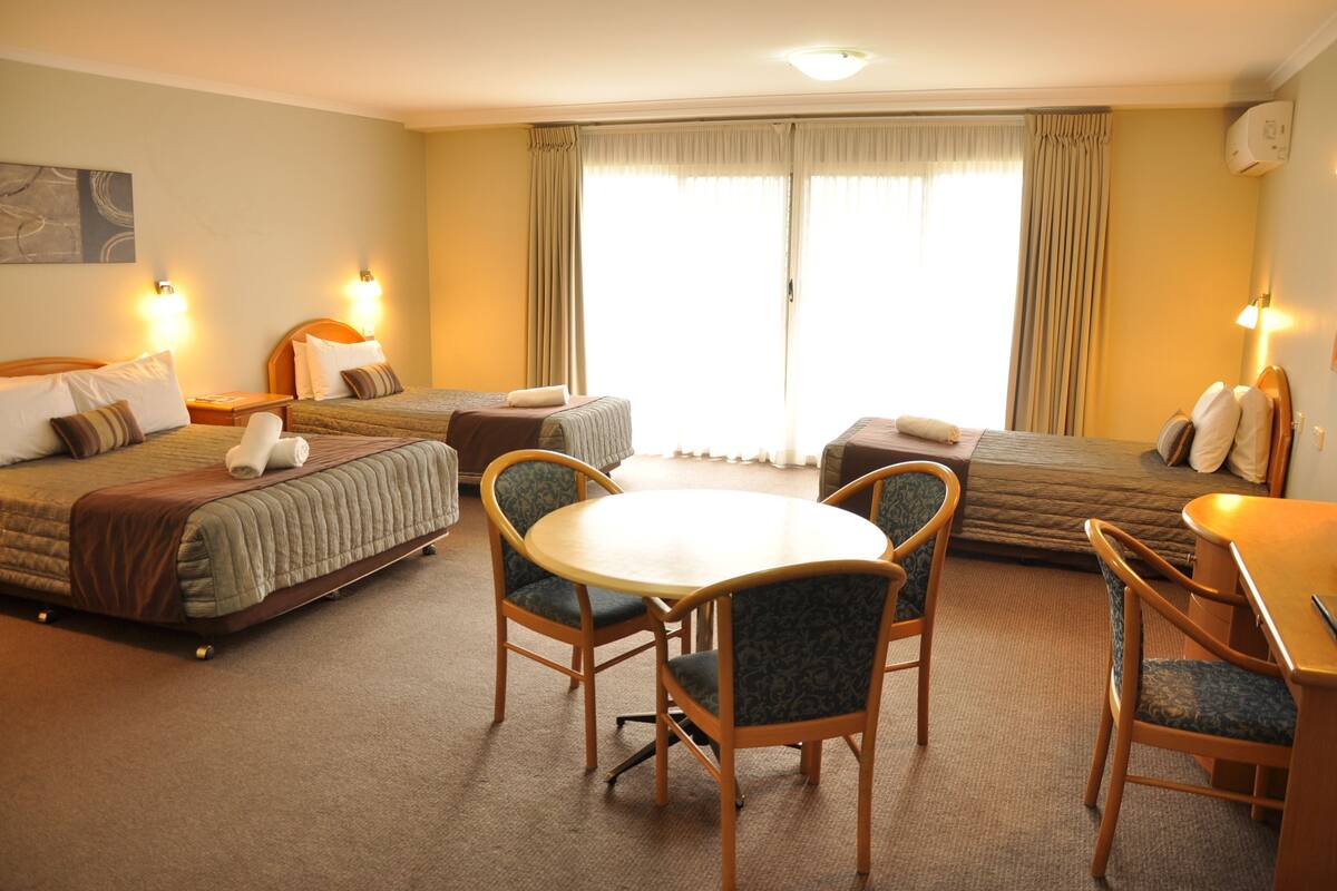 Family Room (Deluxe) | Premium bedding, desk, iron/ironing board, cribs/infant beds