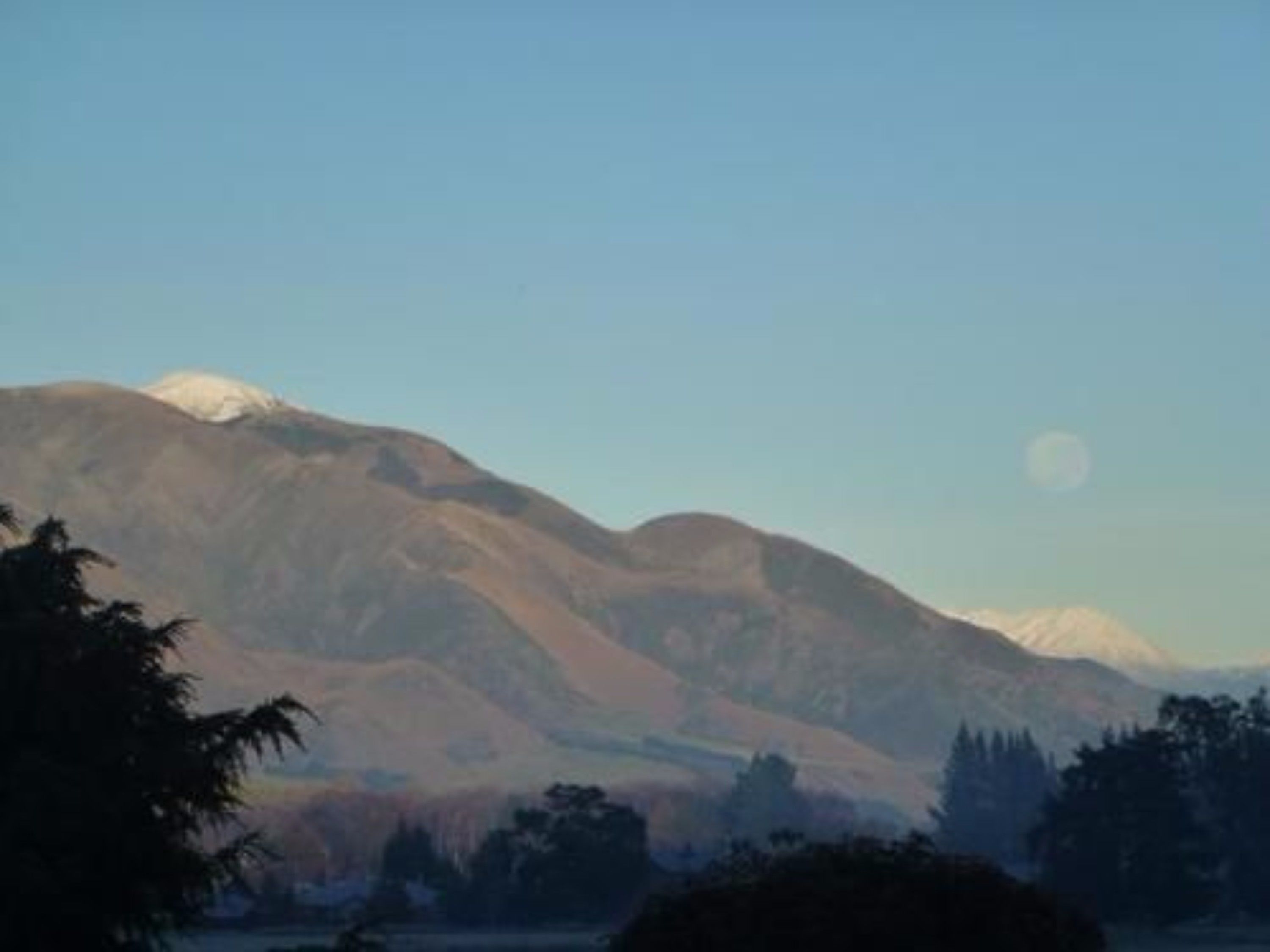 A mountain landscape with a clear sky.